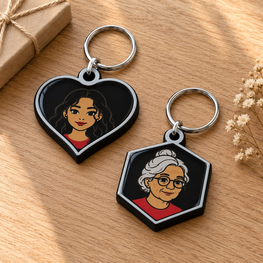 Two personalised photo keychains on a wooden table