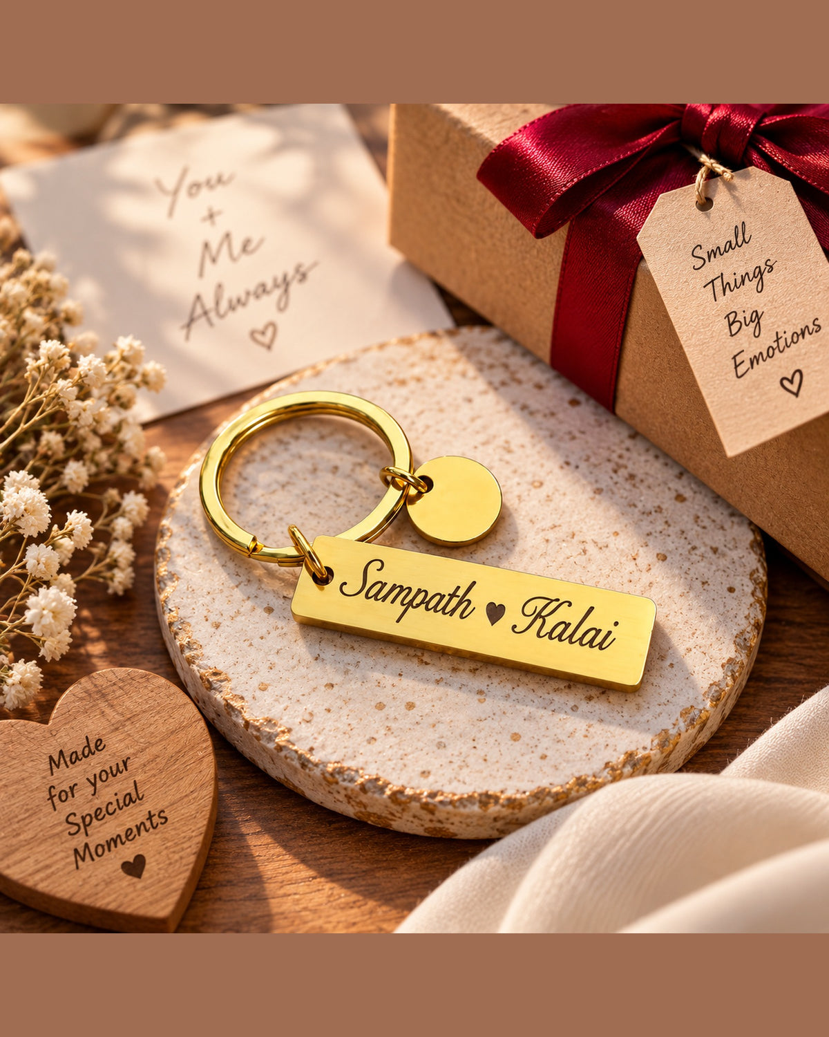 Engraved couple name keychain in gold steel with a gift box and ribbon – personalised anniversary gift