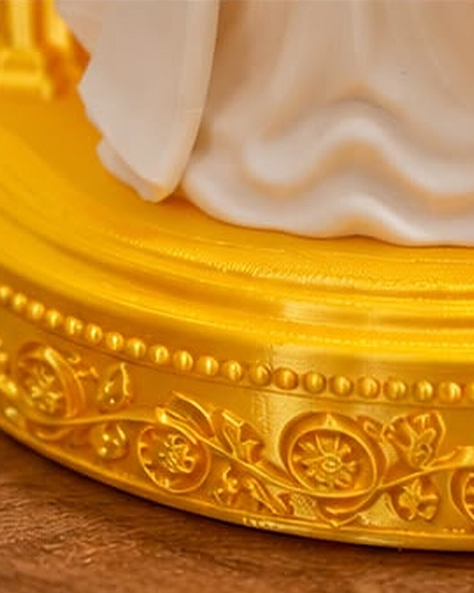 Close-up of the gold floral base with pearl beading